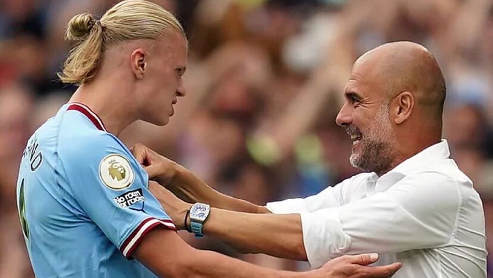 Erling Haaland con su todavía entrenador, Pep Guardiola.