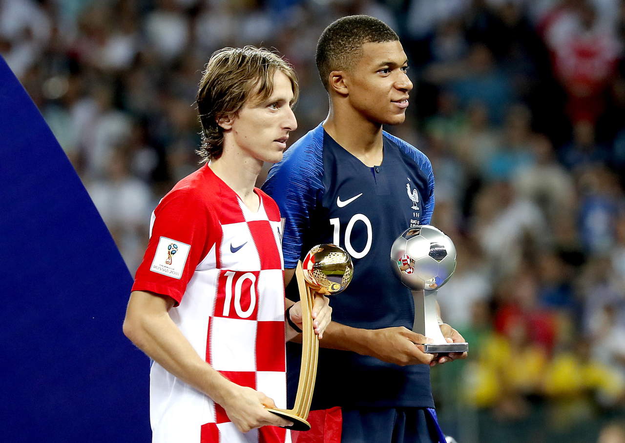 Luka Modric y Kylian Mbappé